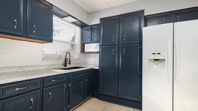 639 W Elk St, Freeport, IL 61032 - kitchen with white appliances, a sink, decorative backsplash, and light countertops