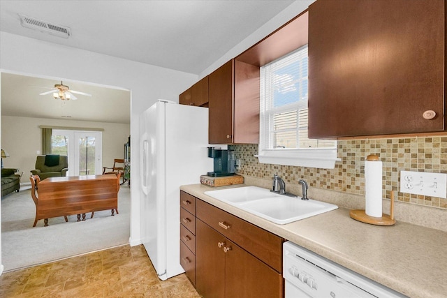 3407 Nobel Dr, Champaign, IL 61822 - kitchen featuring a sink, white appliances, ceiling fan, light countertops, and tasteful backsplash