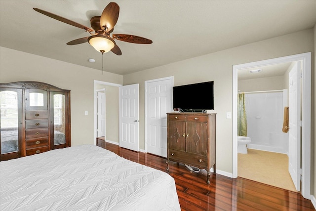 3407 Nobel Dr, Champaign, IL 61822 - bedroom with dark wood-style flooring, connected bathroom, baseboards, and a ceiling fan