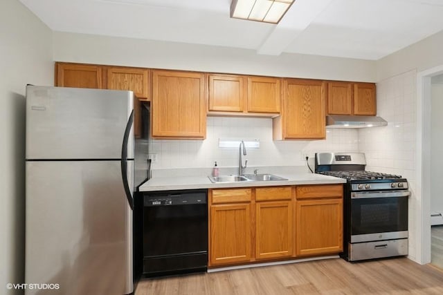 1137 Leavitt Ave Unit 118, Flossmoor, IL 60422 - kitchen featuring appliances with stainless steel finishes, under cabinet range hood, light countertops, decorative backsplash, and light wood-style floors