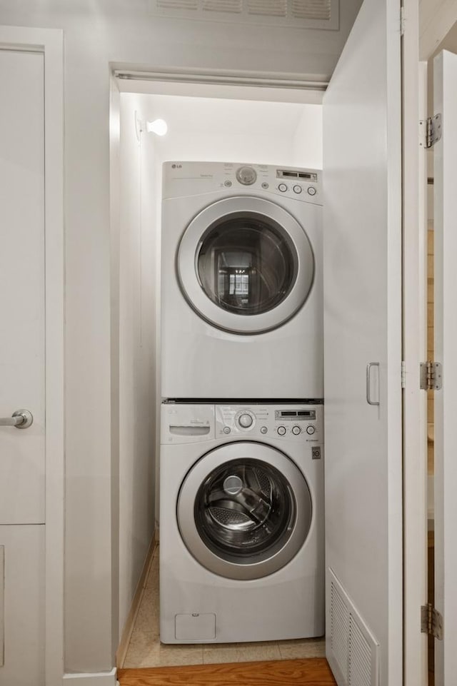 130 S Canal St Unit 210, Chicago, IL 60606 - laundry room featuring stacked washing machine and dryer