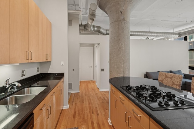 130 S Canal St Unit 210, Chicago, IL 60606 - kitchen featuring black appliances, light wood-type flooring, dark stone countertops, and light brown cabinetry