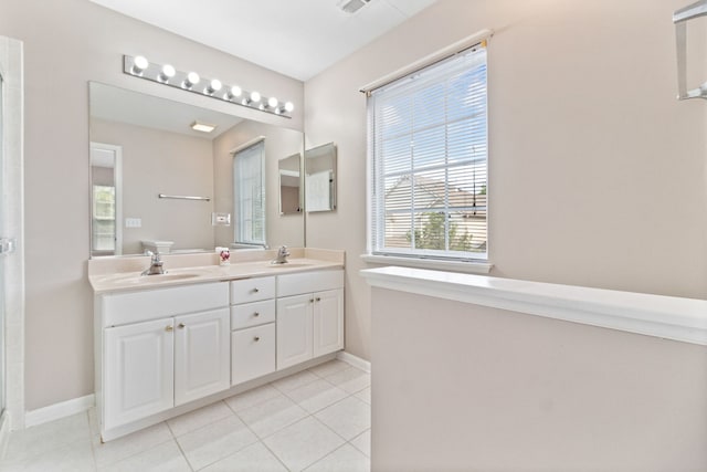 390 Jamestown Ct, Aurora, IL 60502 - bathroom with double vanity, baseboards, tile patterned floors, and a shower