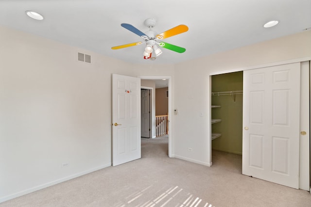 390 Jamestown Ct, Aurora, IL 60502 - unfurnished bedroom with light carpet, a closet, baseboards, and ceiling fan