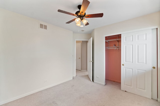 390 Jamestown Ct, Aurora, IL 60502 - unfurnished bedroom with light colored carpet, baseboards, a closet, and ceiling fan