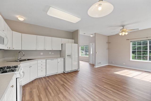 390 Jamestown Ct, Aurora, IL 60502 - kitchen featuring white appliances, a sink, light wood-style floors, light countertops, and white cabinets