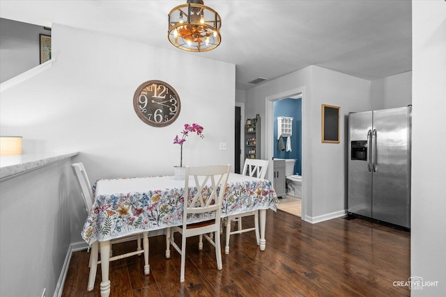 28 Waterbury Cir, Oswego, IL 60543 - dining room with a chandelier and wood finished floors