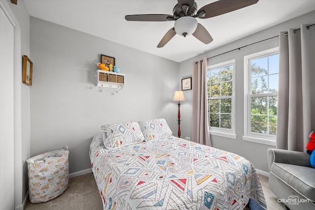 28 Waterbury Cir, Oswego, IL 60543 - carpeted bedroom with baseboards and ceiling fan
