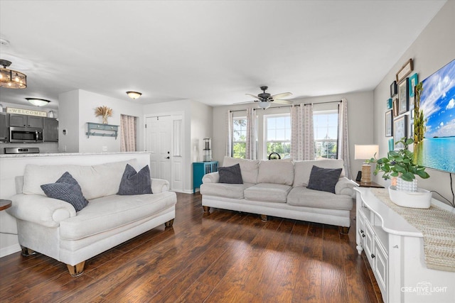 28 Waterbury Cir, Oswego, IL 60543 - living room with dark wood-style floors and a ceiling fan