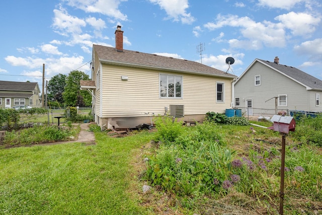 424 Robinson St, Earlville, IL 60518 - back of property with a chimney and central AC unit