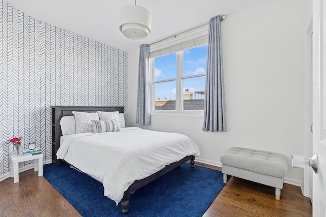 1632 W Erie St Unit 3, Chicago, IL 60622 - bedroom featuring wallpapered walls, an accent wall, and wood finished floors