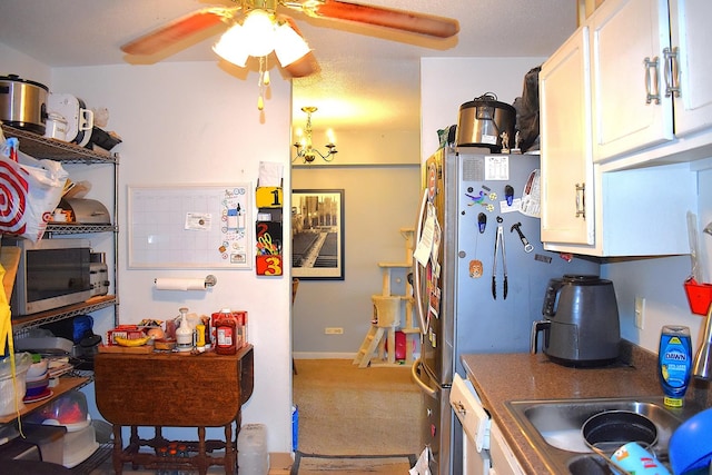 2201 S Stewart Ave Unit 5H, Lombard, IL 60148 - kitchen with a ceiling fan, white cabinets, stainless steel microwave, and carpet floors