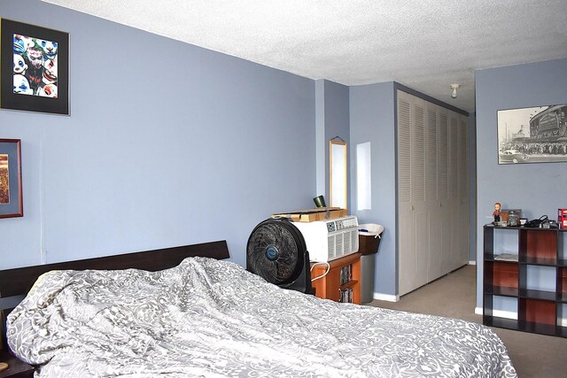 2201 S Stewart Ave Unit 5H, Lombard, IL 60148 - carpeted bedroom with a closet and a textured ceiling