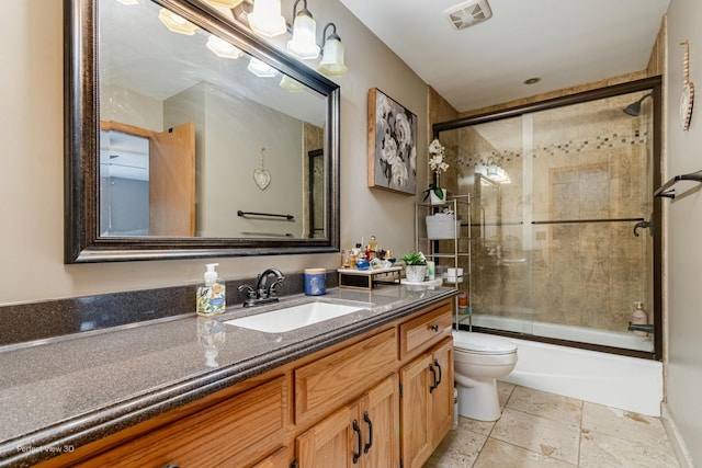 2665 Daniel Lewis Dr, New Lenox, IL 60451 - bathroom featuring toilet, vanity, combined bath / shower with glass door, and stone tile floors