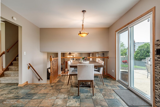 2665 Daniel Lewis Dr, New Lenox, IL 60451 - dining room featuring stone finish floors, baseboards, and stairway