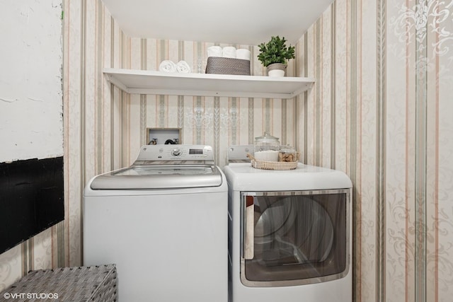161 E Chicago Ave Unit 39F, Chicago, IL 60611 - washroom with wallpapered walls and washing machine and dryer