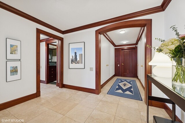 161 E Chicago Ave Unit 39F, Chicago, IL 60611 - entrance foyer with crown molding, baseboards, light tile patterned floors, and arched walkways
