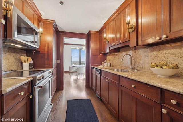 161 E Chicago Ave Unit 39F, Chicago, IL 60611 - kitchen featuring appliances with stainless steel finishes, a sink, tasteful backsplash, and dark wood-type flooring