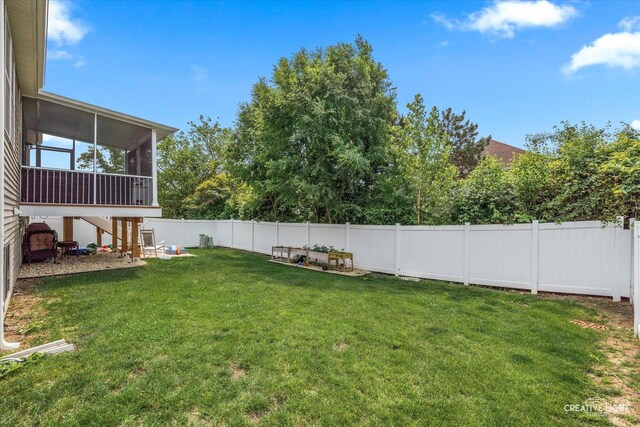 1285 Highpoint Ct, Bartlett, IL 60103 - fenced backyard with a sunroom