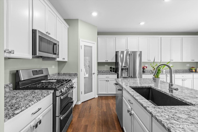 1285 Highpoint Ct, Bartlett, IL 60103 - kitchen featuring appliances with stainless steel finishes, dark wood-style flooring, white cabinets, light stone counters, and recessed lighting