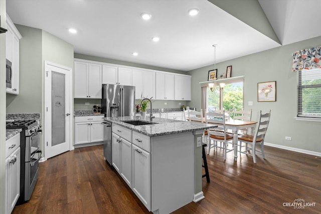 1285 Highpoint Ct, Bartlett, IL 60103 - kitchen featuring stainless steel appliances, dark wood-style floors, white cabinetry, a center island with sink, and light stone counters
