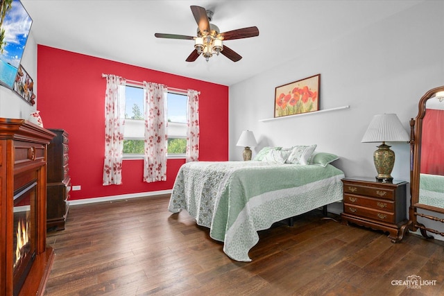 1285 Highpoint Ct, Bartlett, IL 60103 - bedroom featuring a glass covered fireplace, hardwood / wood-style floors, and ceiling fan