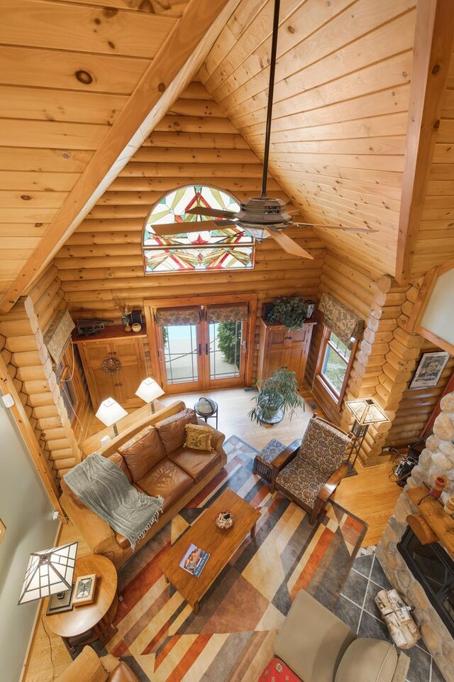 10415 Ridge Ln, Huntley, IL 60142 - living room with log walls, french doors, wooden ceiling, wood finished floors, and high vaulted ceiling