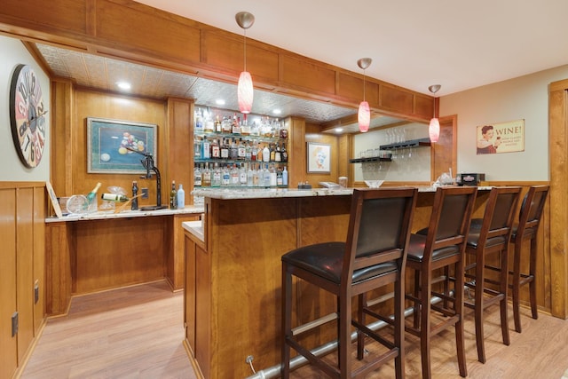 10415 Ridge Ln, Huntley, IL 60142 - indoor wet bar featuring light wood-type flooring and pendant lighting