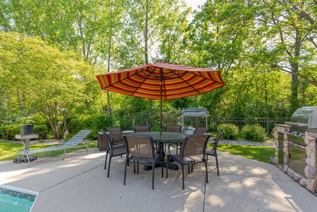 10415 Ridge Ln, Huntley, IL 60142 - view of patio featuring outdoor dining space, exterior kitchen, and view of wooded area