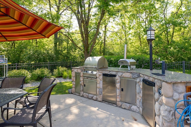 10415 Ridge Ln, Huntley, IL 60142 - view of patio / terrace with area for grilling, outdoor dining space, and view of wooded area