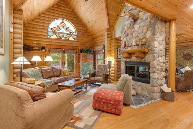 10415 Ridge Ln, Huntley, IL 60142 - living room with log walls, wood ceiling, high vaulted ceiling, wood finished floors, and a stone fireplace