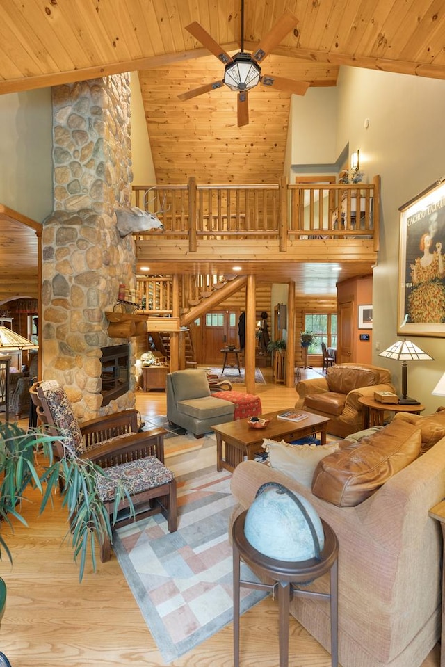 10415 Ridge Ln, Huntley, IL 60142 - living room with wooden ceiling, high vaulted ceiling, wood finished floors, a ceiling fan, and a stone fireplace