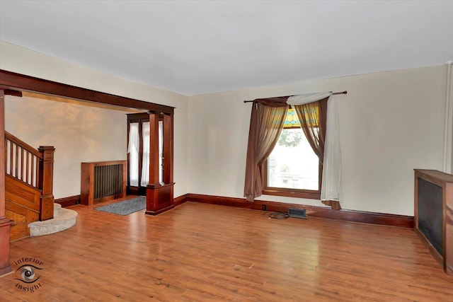 116 N Kankakee St, Wilmington, IL 60481 - unfurnished living room with wood finished floors, baseboards, and stairway
