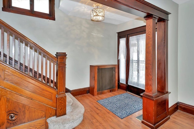 116 N Kankakee St, Wilmington, IL 60481 - foyer entrance with stairway, wood finished floors, decorative columns, and baseboards