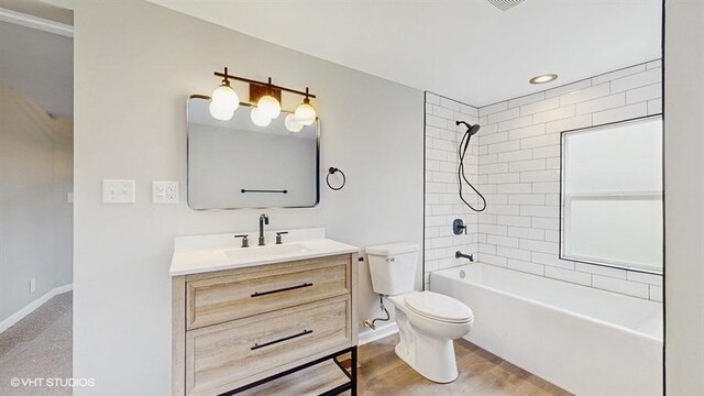4622 Schwartz Ave, Lisle, IL 60532 - bathroom featuring toilet, vanity, shower / bath combination, and baseboards