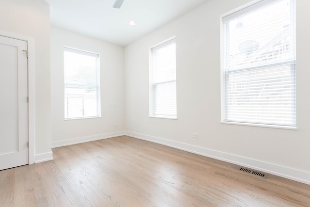 1407 N Bosworth Ave, Chicago, IL 60642 - unfurnished room featuring light wood-style floors, baseboards, and a ceiling fan