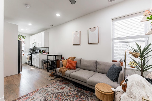 1407 N Bosworth Ave, Chicago, IL 60642 - living room with light wood-style floors and recessed lighting