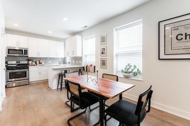 1407 N Bosworth Ave, Chicago, IL 60642 - dining room with recessed lighting, light wood-type flooring, and baseboards