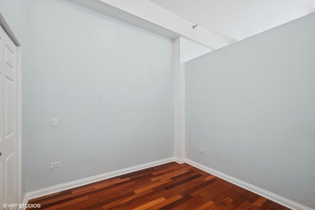 8 W Monroe St Unit 902, Chicago, IL 60603 - empty room featuring dark wood-style floors and baseboards