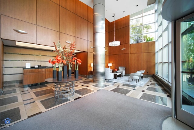 201 N Westshore Dr Unit 2102, Chicago, IL 60601 - lobby featuring a high ceiling and wooden walls
