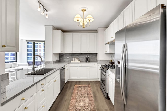 201 N Westshore Dr Unit 2102, Chicago, IL 60601 - kitchen with stainless steel appliances, a sink, white cabinets, and dark wood-style floors