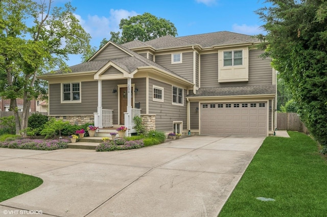 234 E Saint Charles Rd, Elmhurst, IL 60126 - view of front facade featuring concrete driveway, an attached garage, a shingled roof, and stone siding