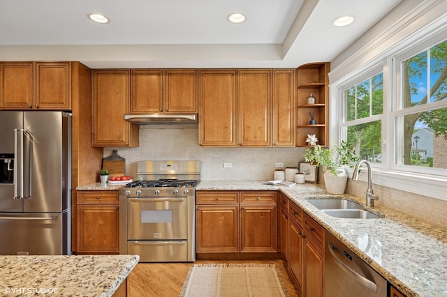 234 E Saint Charles Rd, Elmhurst, IL 60126 - kitchen with stainless steel appliances, under cabinet range hood, brown cabinetry, and recessed lighting