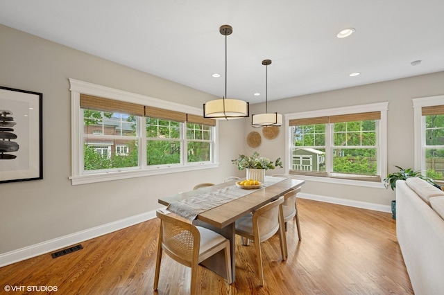 234 E Saint Charles Rd, Elmhurst, IL 60126 - dining space featuring light wood-style flooring, healthy amount of natural light, an AC wall unit, and recessed lighting