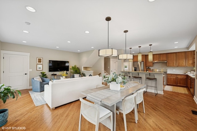 234 E Saint Charles Rd, Elmhurst, IL 60126 - dining space with light wood finished floors, recessed lighting, and stairs
