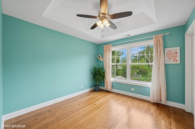 234 E Saint Charles Rd, Elmhurst, IL 60126 - spare room featuring a raised ceiling, wood finished floors, and a ceiling fan