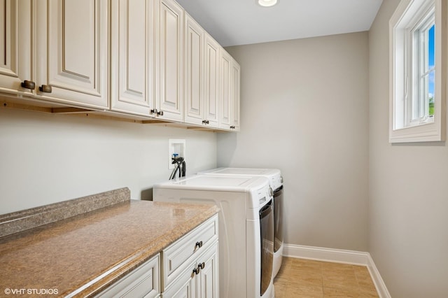 234 E Saint Charles Rd, Elmhurst, IL 60126 - washroom featuring cabinet space, washer and dryer, and light tile patterned floors