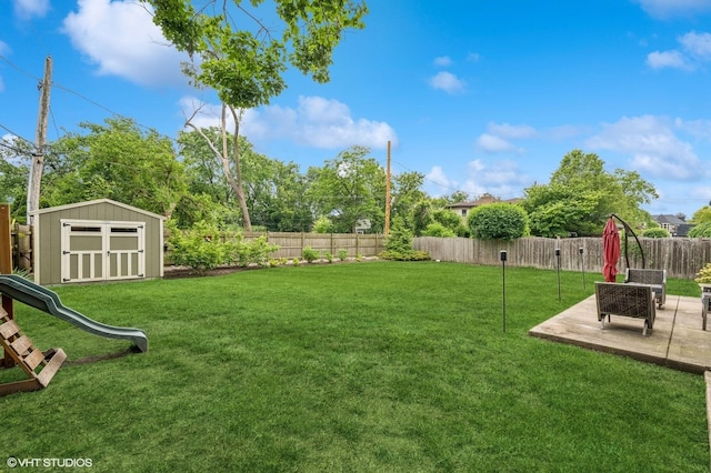 234 E Saint Charles Rd, Elmhurst, IL 60126 - fenced backyard with a storage unit and a patio area