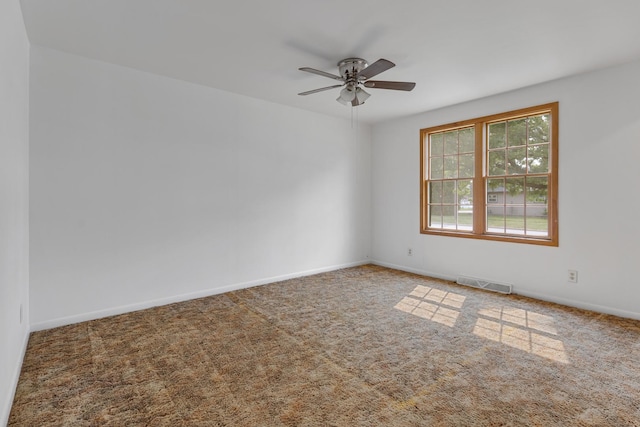 510 S Sycamore St, Genoa, IL 60135 - empty room featuring ceiling fan, carpet flooring, and baseboards