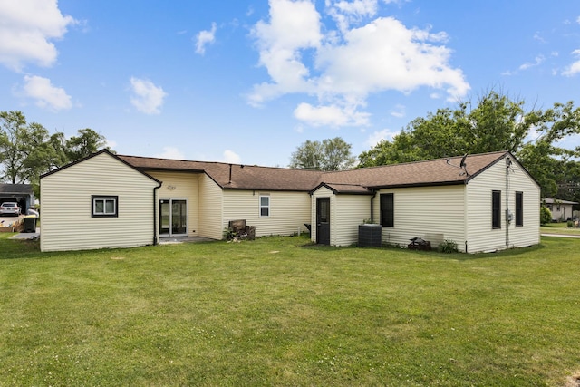 510 S Sycamore St, Genoa, IL 60135 - back of property with a yard and roof with shingles
